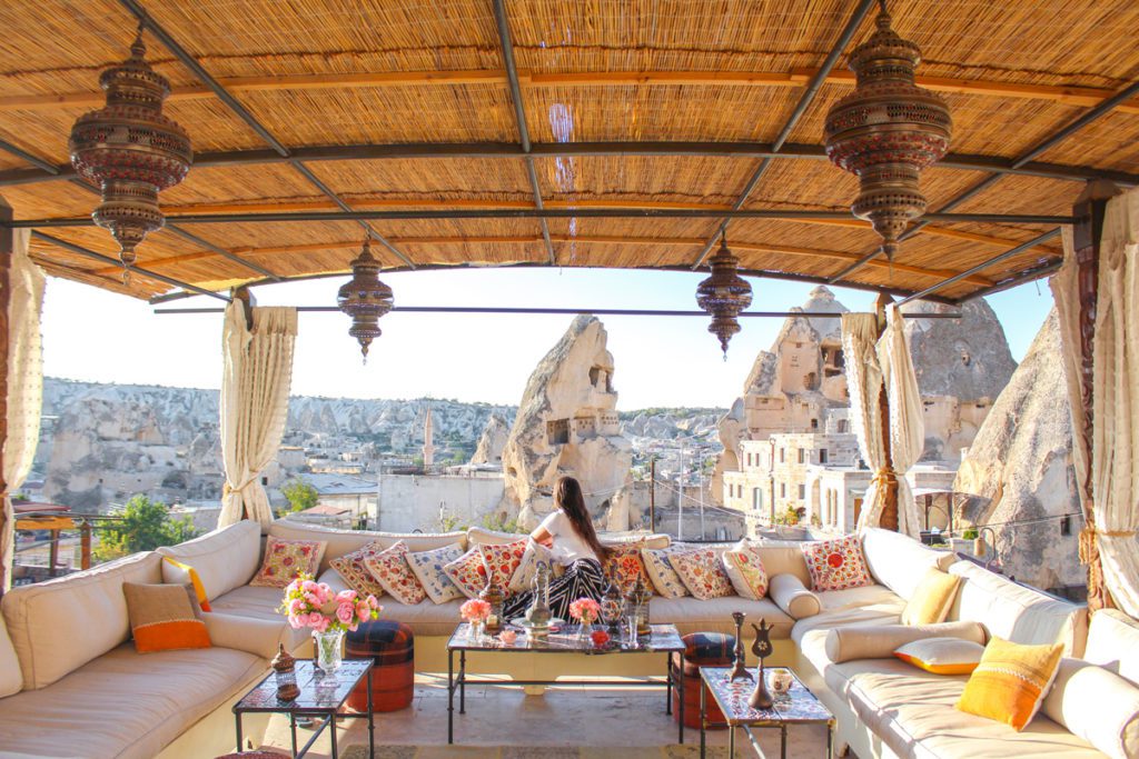 girl sitting on artemis cave suites balcony