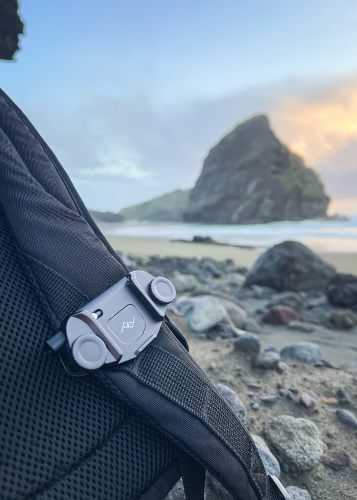 peak design camera clip at new zealand beach